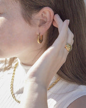 Load image into Gallery viewer, woman wearing 18 karat gold plated hoop earrings, a chunky statement ring and a rope chain
