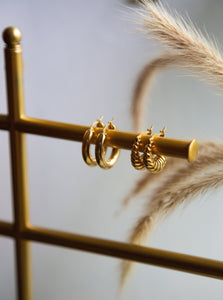 two pairs of 18 karat gold plated hoop earrings